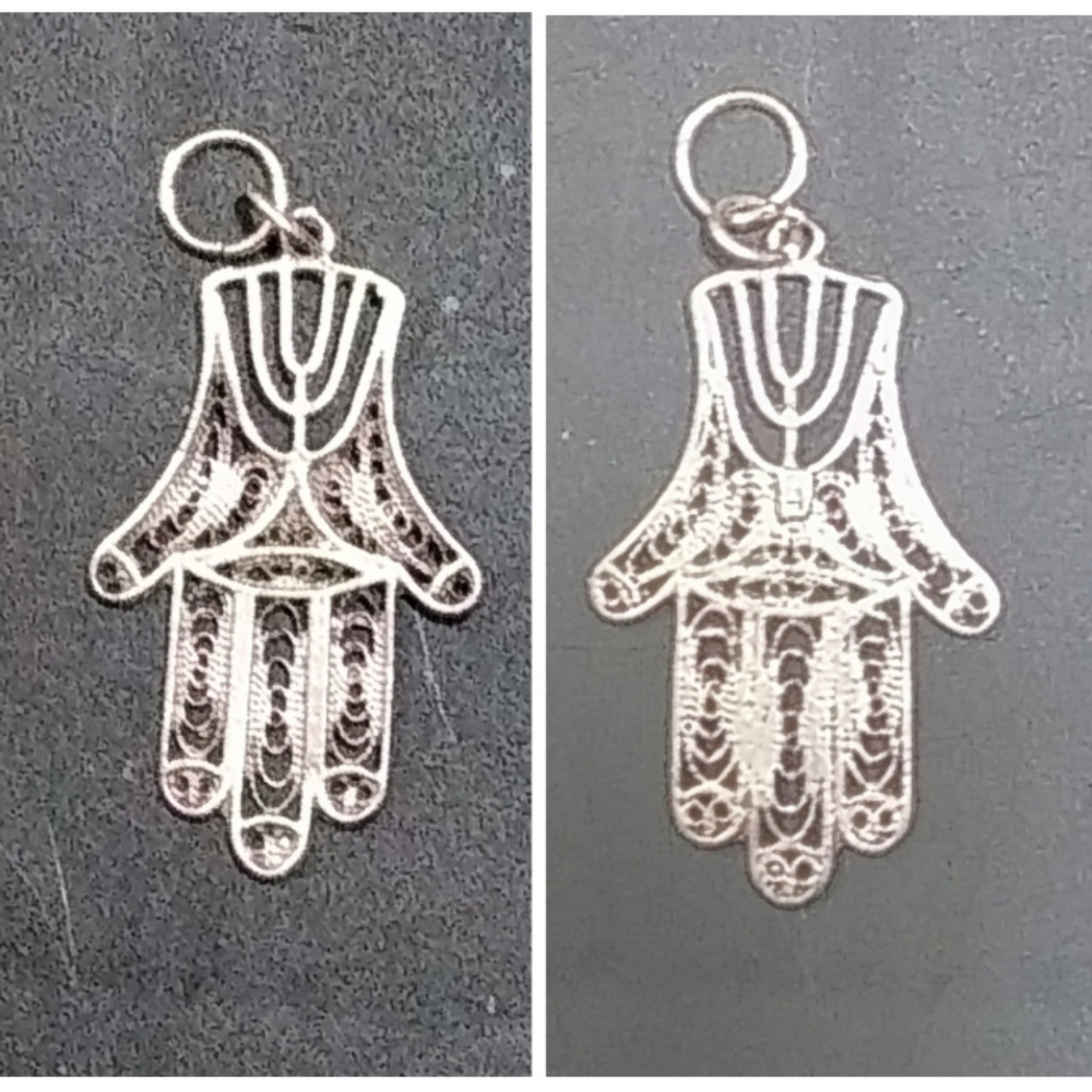 Silver filligre hamsa hand protection jewelry charm.